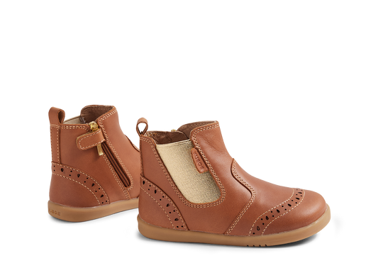 Pair of brown children's boots on a white background